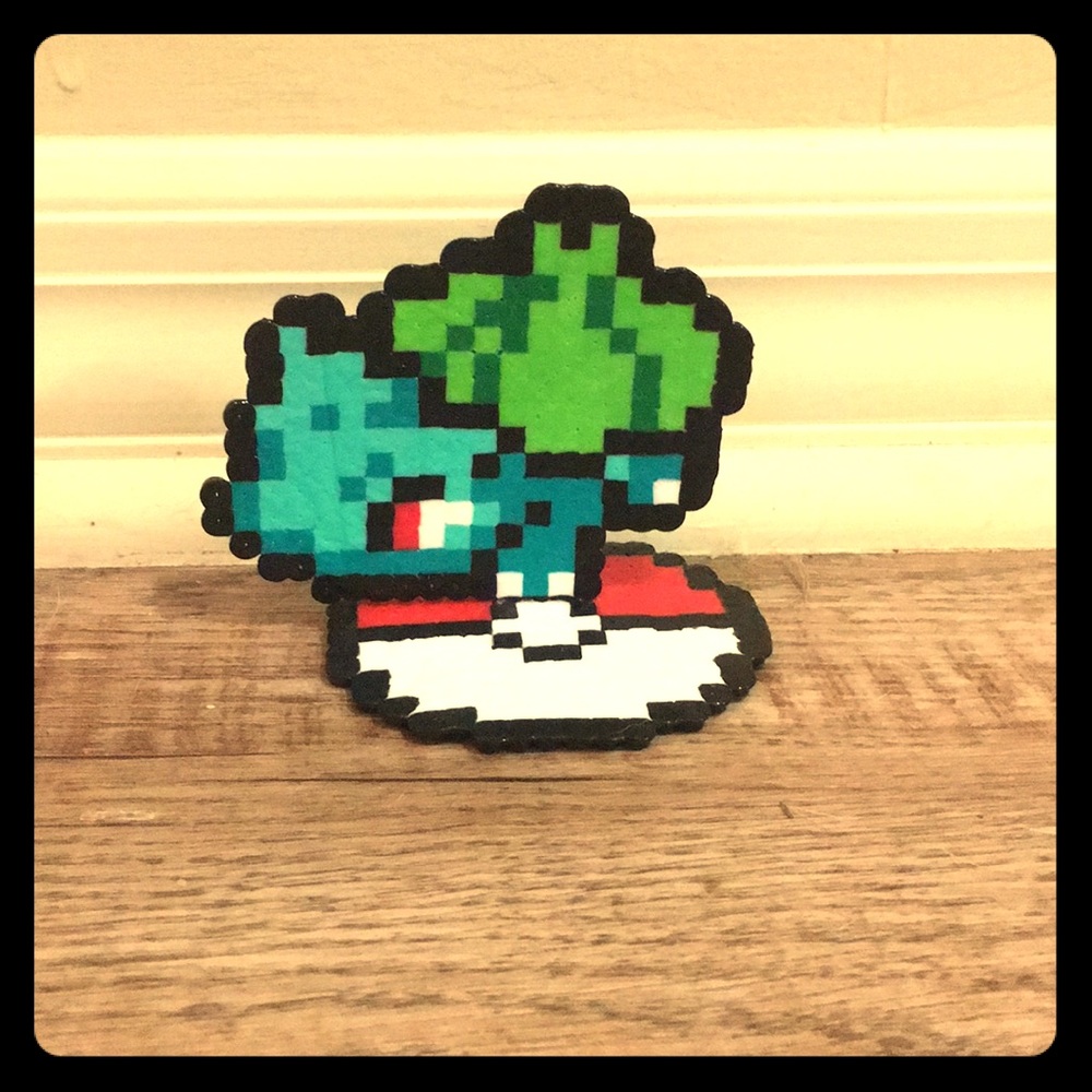 Bulbasour Pokémon standing on a Poké Ball.